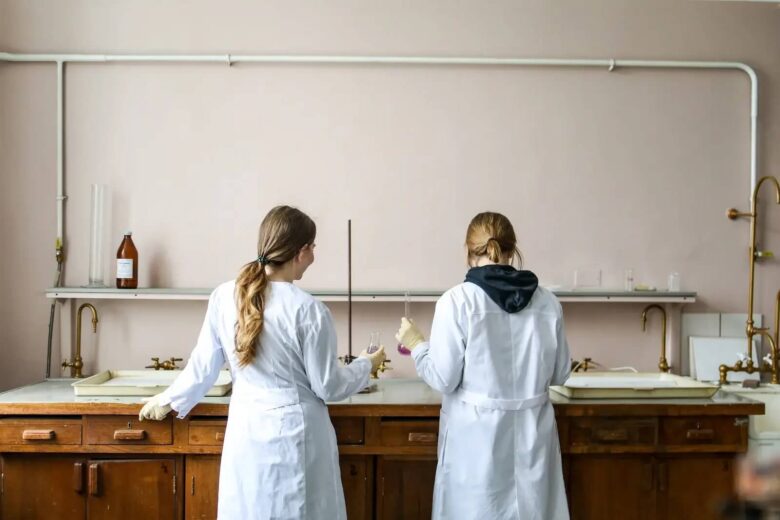 Two women in science, working in a lab
