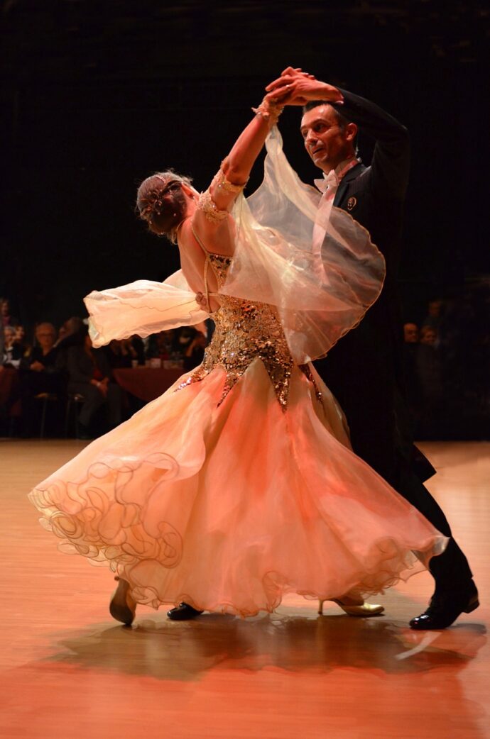 Two people doing the popular dance: waltz